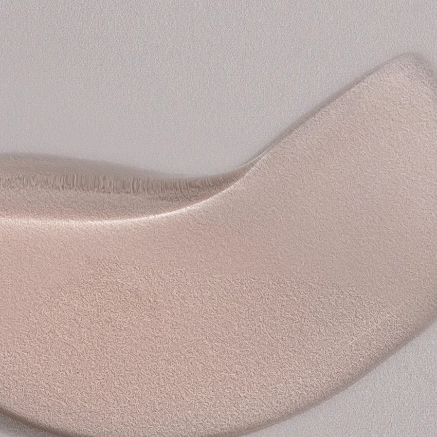 Close-up texture - slightly pink, gel-like mask texture