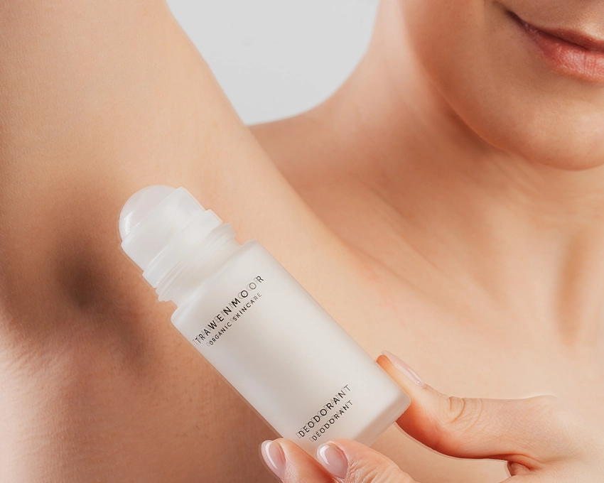 Woman applies Trawenmoor deodorant