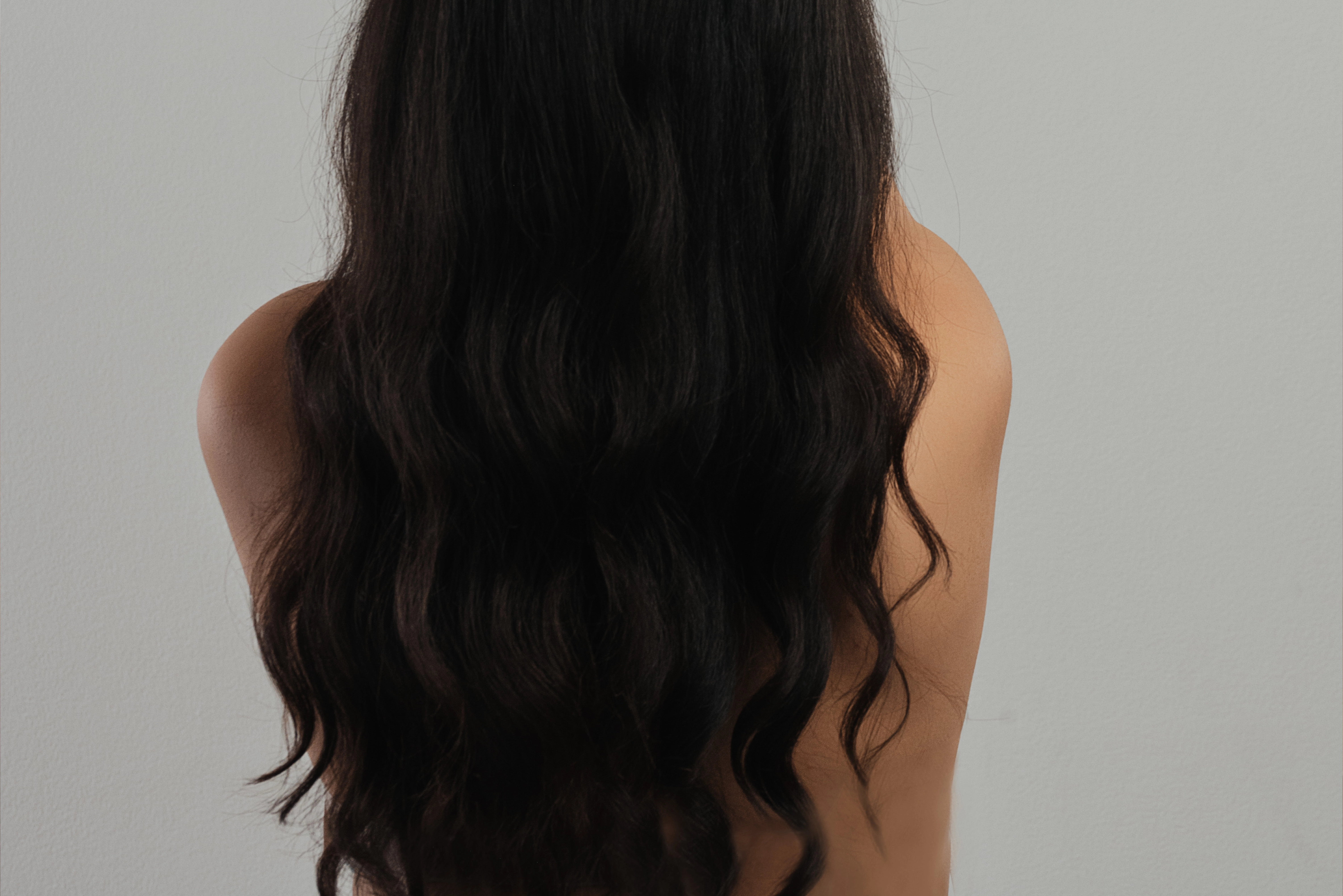 Woman from behind with very long dark hair