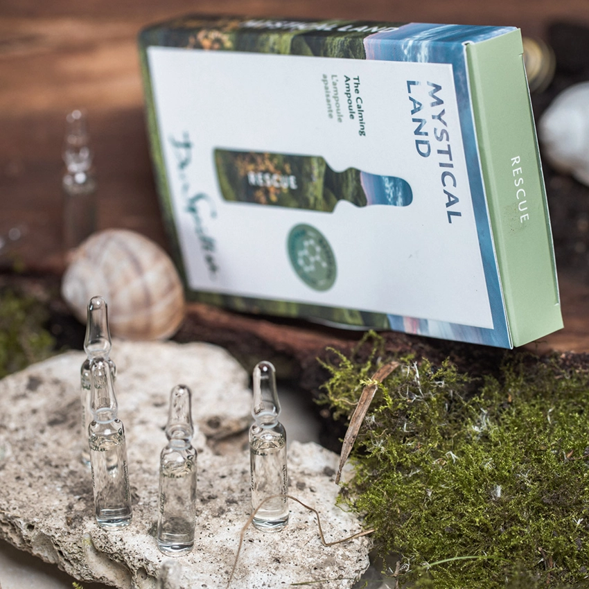 Facial ampoules placed on a rock