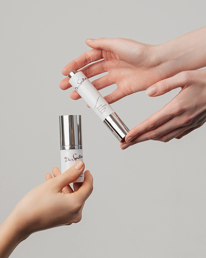 Peptide Performance Eye & Lip Serum and Cream is held in the hands of two women