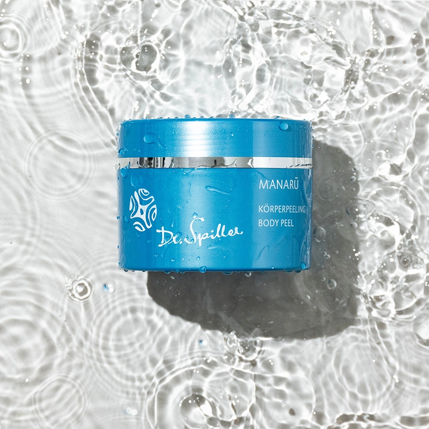 MANARU body scrub lies in clear water
