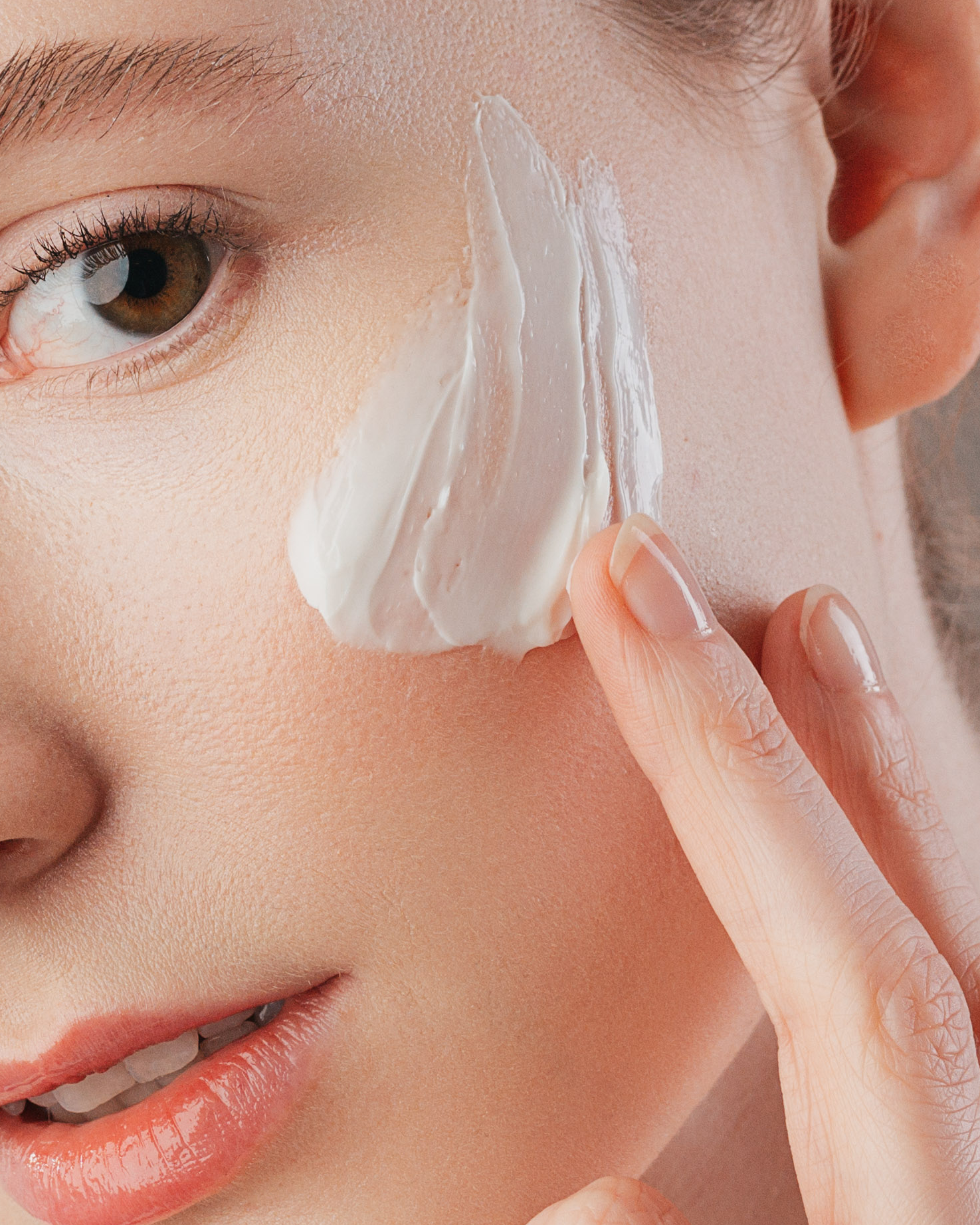 Face cream application on the cheek