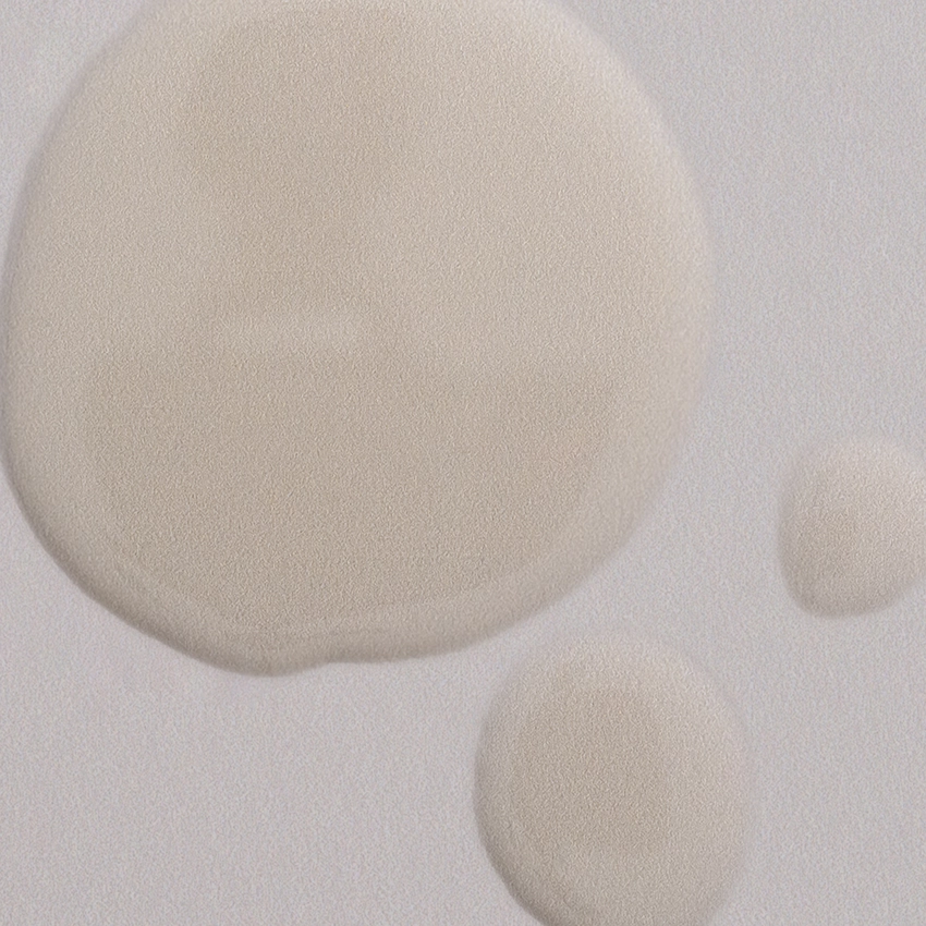 Close-up texture - transparent, slightly yellowish argan oil deluxe