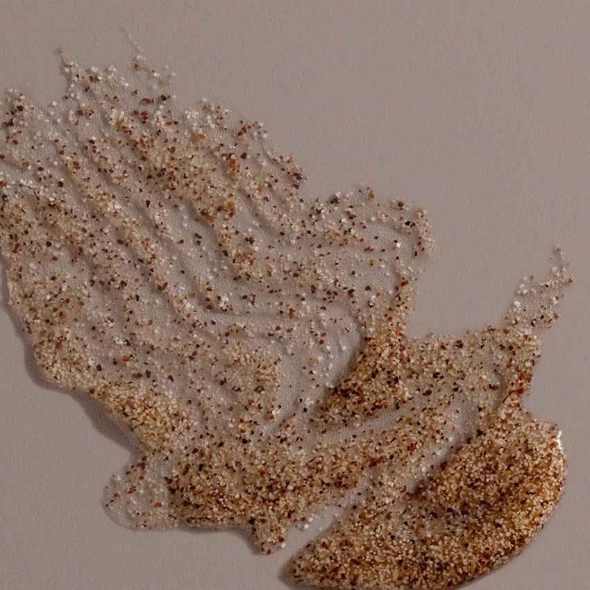 Close-up texture - Gentle Face & Body Peeling Gel brownish texture with peeling grains