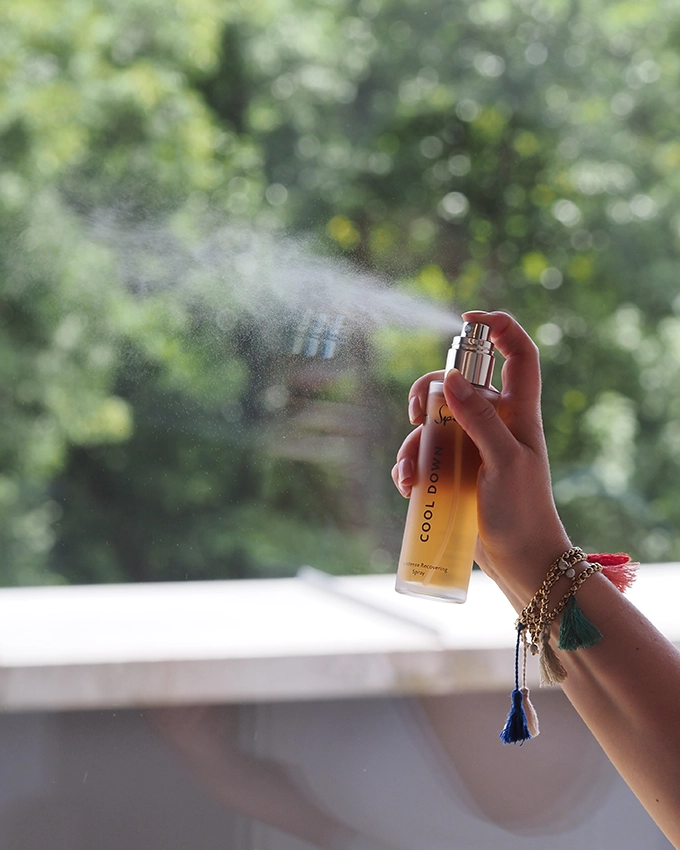 The Intense Recovering Spray spray bottle in action