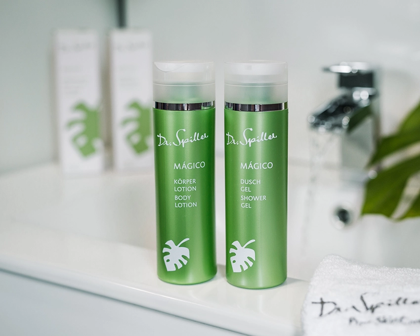 MAGICO body lotion and shower gel next to each other on a washbasin