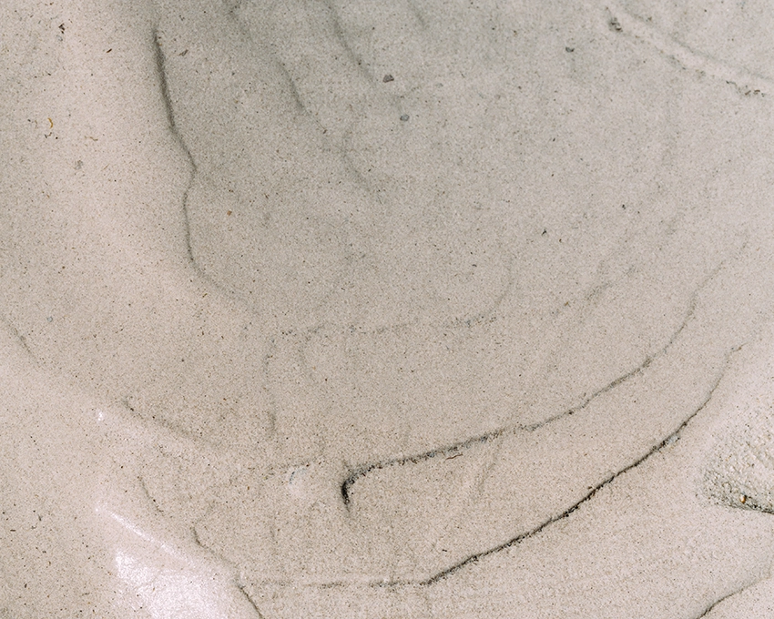 Natürliche Strukturen auf Sand