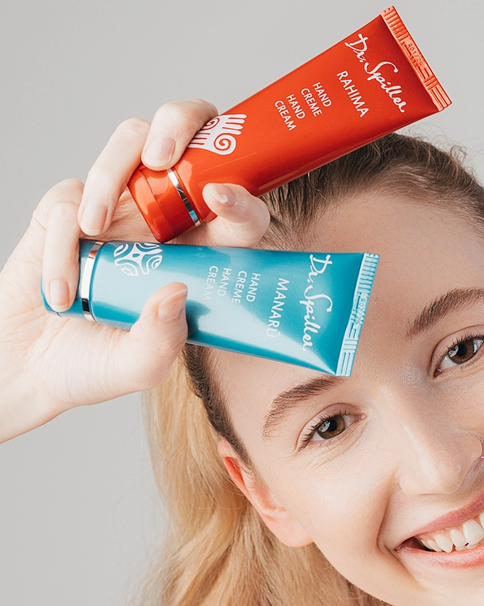 Manaru & Rahima hand cream with laughing woman