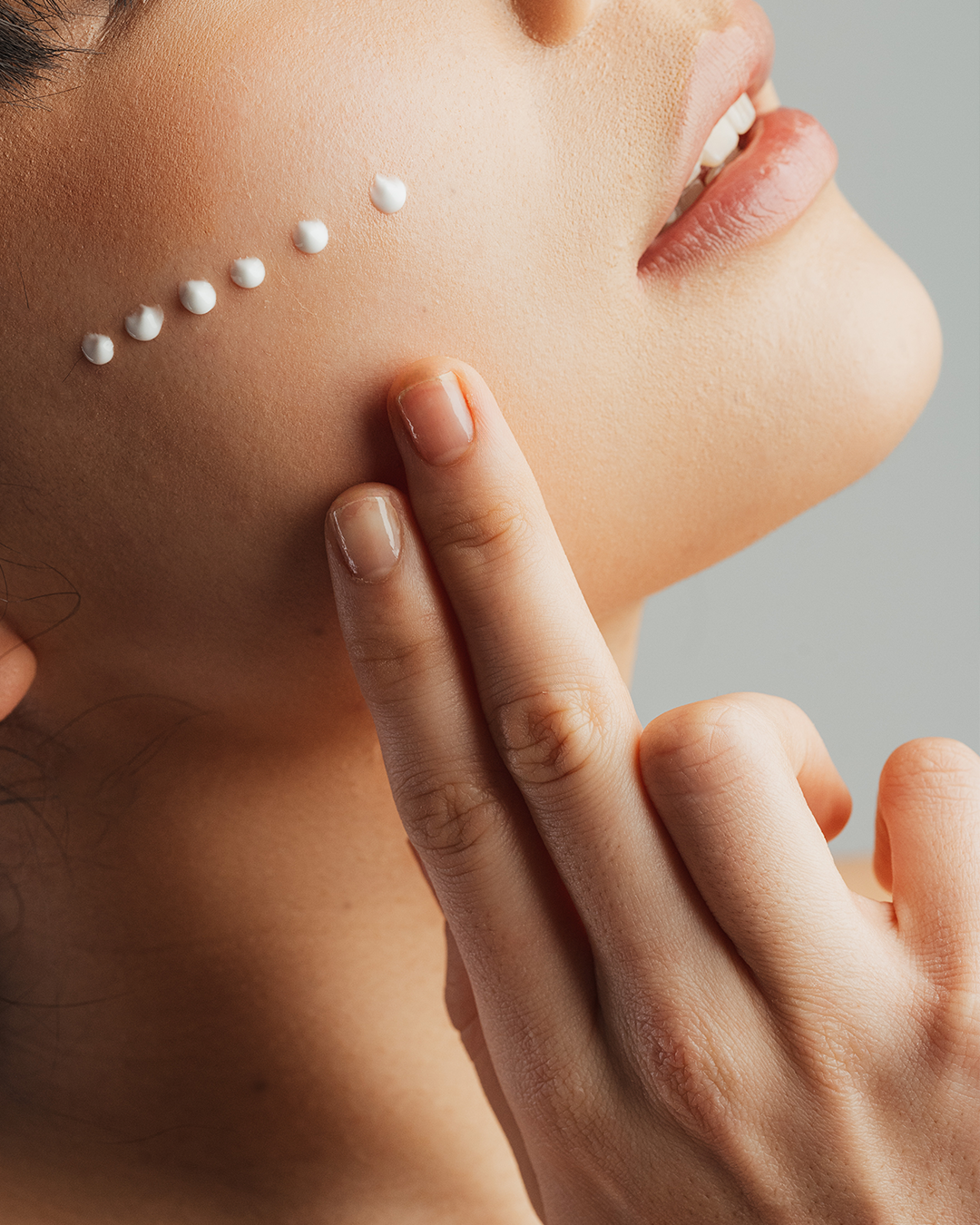 Woman with cream on skin