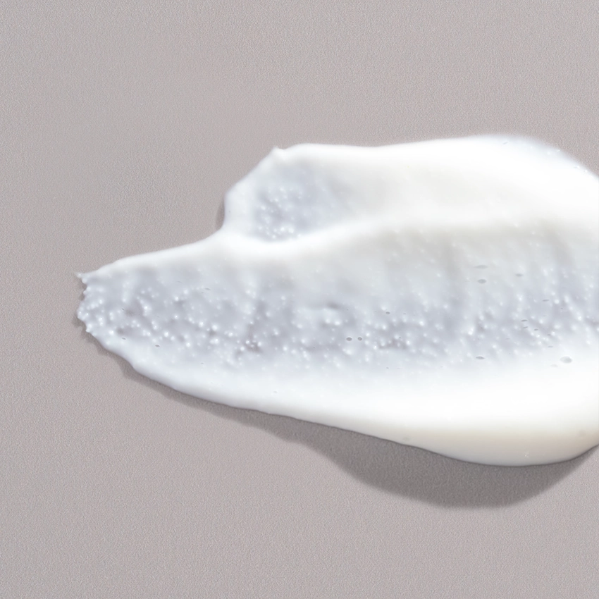 Nahaufnahme Textur - weißes Peeling mit Peelingkörnern