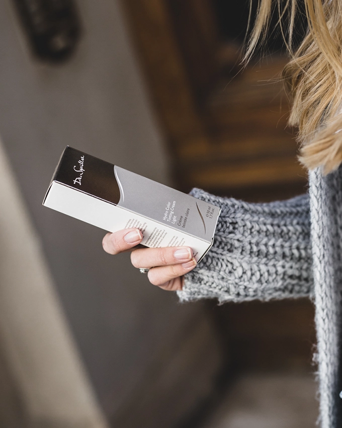 Dr. Spiller skin care product packaging in the hand