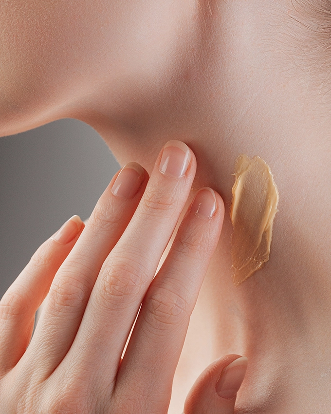 Neck and décolleté care is applied to the neck