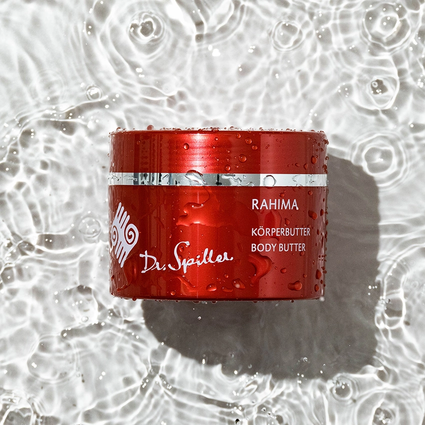 Rahima body butter lies in the clear water